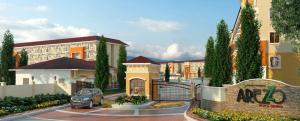 a rendering of a parking lot in front of a building at Queen's Place Arezzo Davao in Davao City
