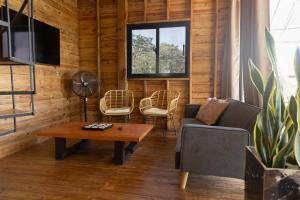 a living room with a couch and a table at Casa Loma, Descansar en la Montaña, 30min STG in La Búcara