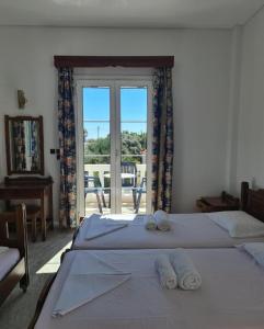 Postel nebo postele na pokoji v ubytování Villa Angeliki II