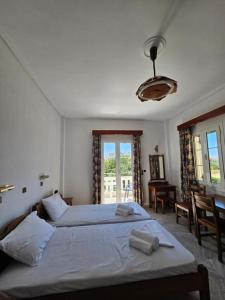 Postel nebo postele na pokoji v ubytování Villa Angeliki II