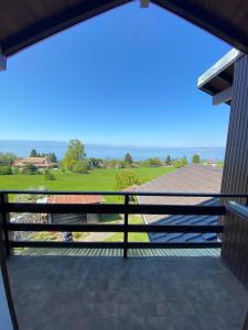 a view from the balcony of a house at Appartement vue lac in Publier +5 photos