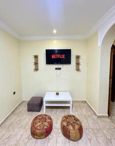 a waiting room with a sign on the wall at Jb house in Chefchaouen