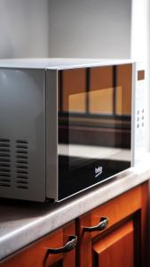 a microwave oven sitting on a kitchen counter at CasaNorah in Fondi