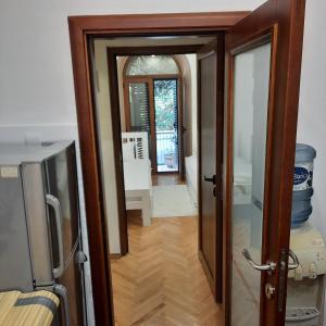 a door leading into a room with a hallway at Apartman HOME Kotor in Kotor +10 photos