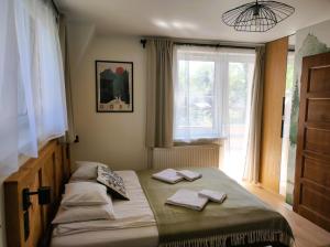 Posteľ alebo postele v izbe v ubytovaní Apartamenty Milka