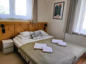 Posteľ alebo postele v izbe v ubytovaní Apartamenty Milka