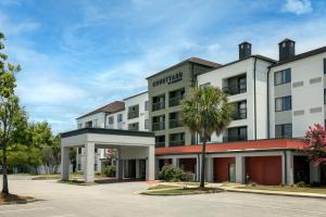 a rendering of the front of the omni hotel at Courtyard by Marriott North Charleston Airport Coliseum in Charleston