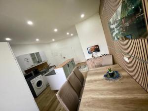 a living room with a kitchen and a dining room at FELGRA Apartment #70 in Knittelfeld