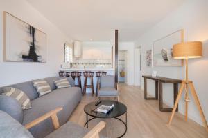 a living room with a couch and a table at Conylanza Castillo de Papagayo - Exclusivamente Nudista FKK in Charco del Palo