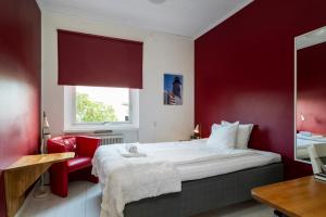 Letto o letti in una camera di Port Hotel