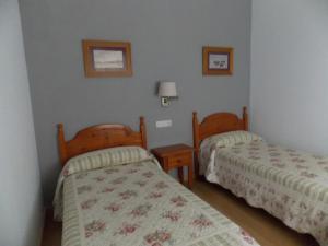 Postel nebo postele na pokoji v ubytování Pensión La Palma