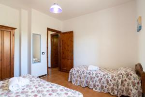 Appartamenti Spiaggia Bianca客房内的一张或多张床位