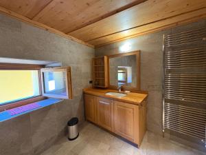 a bathroom with a sink and a mirror at Casa Bavo in Gerola Alta