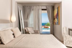 Voodi või voodid majutusasutuse Kassandra Bay Resort, Suites & Spa toas