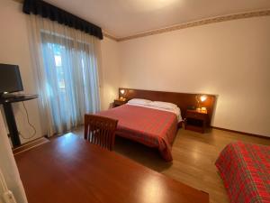 Postel nebo postele na pokoji v ubytování Hotel International