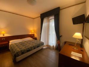 Postel nebo postele na pokoji v ubytování Hotel International