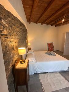 A bed or beds in a room at La Cantina Villa di campagna
