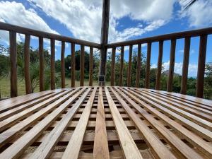 a wooden deck with a view of the mountains at Basecamp Changani in Dar es Salaam