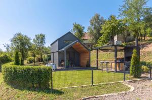 a house on a hill with a fence at Black Emerald - Vrdnik in Vrdnik