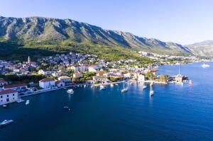 an aerial view of a town with boats in the water at KiM in Mokošica