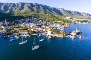 an aerial view of a small harbor with boats in the water at KiM in Mokošica