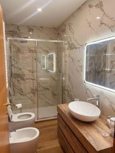 a bathroom with two sinks and a shower at Love story guest house in Cormòns +18 photos