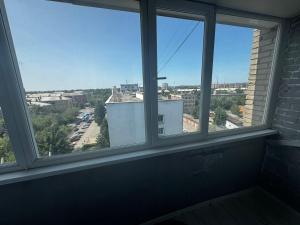 an empty room with a window with a view at Квартира с видом на Усть-Каменогорск in Ustʼ-Kamenogorsk