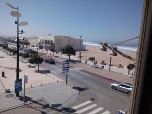 a view from a window of a street near the beach at Apartamento T2 Vista Mar Póvoa de Varzim in Póvoa de Varzim
