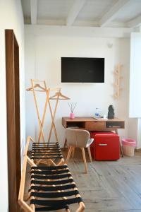 TV a/nebo společenská místnost v ubytování Serenity Apulian Rooms