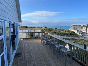 a balcony with chairs and a view of the ocean at Sea and Mountain View in Mossel Bay +77 photos