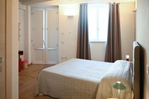 Postel nebo postele na pokoji v ubytování Serenity Apulian Rooms