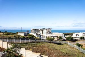 a view of a city with the ocean in the background at Sea and Mountain View in Mossel Bay