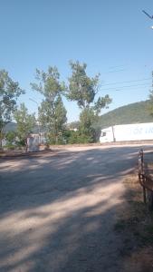 an empty street with a bus on the side of the road at Apartament Ștefania in Orşova