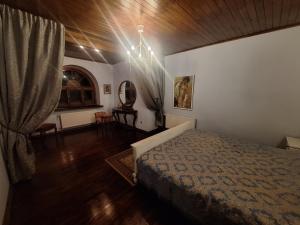 a bedroom with a bed and a chandelier at Rent in summer in Ragaciems +132 photos