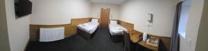 a small room with two beds and a television at Burntisland House in Burntisland +31 photos