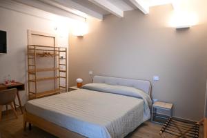 Postel nebo postele na pokoji v ubytování Serenity Apulian Rooms