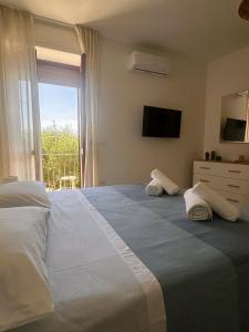 Postel nebo postele na pokoji v ubytování Casa Totò + 18 fotografií