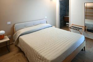 Postel nebo postele na pokoji v ubytování Serenity Apulian Rooms