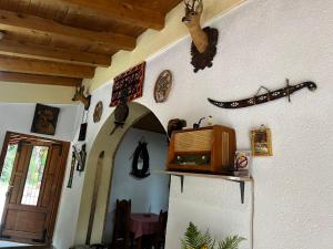 a room with a microwave on a wall at Resort Komovi in Kravlja