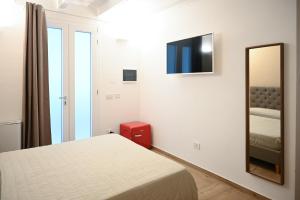 Postel nebo postele na pokoji v ubytování Serenity Apulian Rooms
