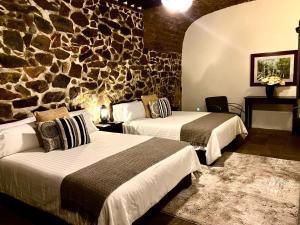 Voodi või voodid majutusasutuse HOTEL MINA REAL toas