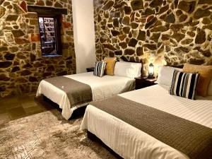 Voodi või voodid majutusasutuse HOTEL MINA REAL toas