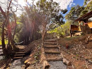 a set of stairs leading up to a house at Sítio Passarim in São Francisco Xavier
