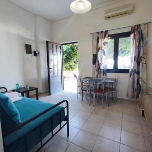 a bedroom with a bed and a table and chairs at Limanaki in Kymi +30 photos