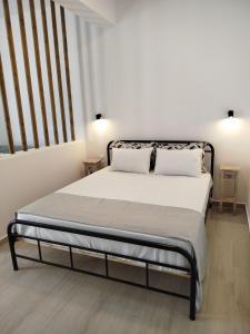 a bed with two pillows on it in a room at Mary's House 2 in Skiros