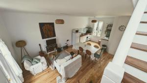 an overhead view of a living room with white furniture at La Maison Verdemar in Hendaye