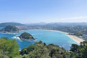 a view of a beach with boats in the water at La Maison Verdemar in Hendaye