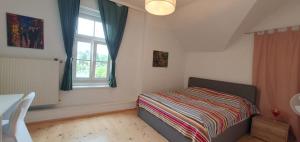 Giường trong phòng chung tại Victorias Apartment