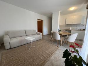 a living room with a couch and a table at Galeb in Igalo