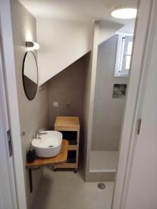 a bathroom with a sink and a shower at Mary's House 2 in Skiros